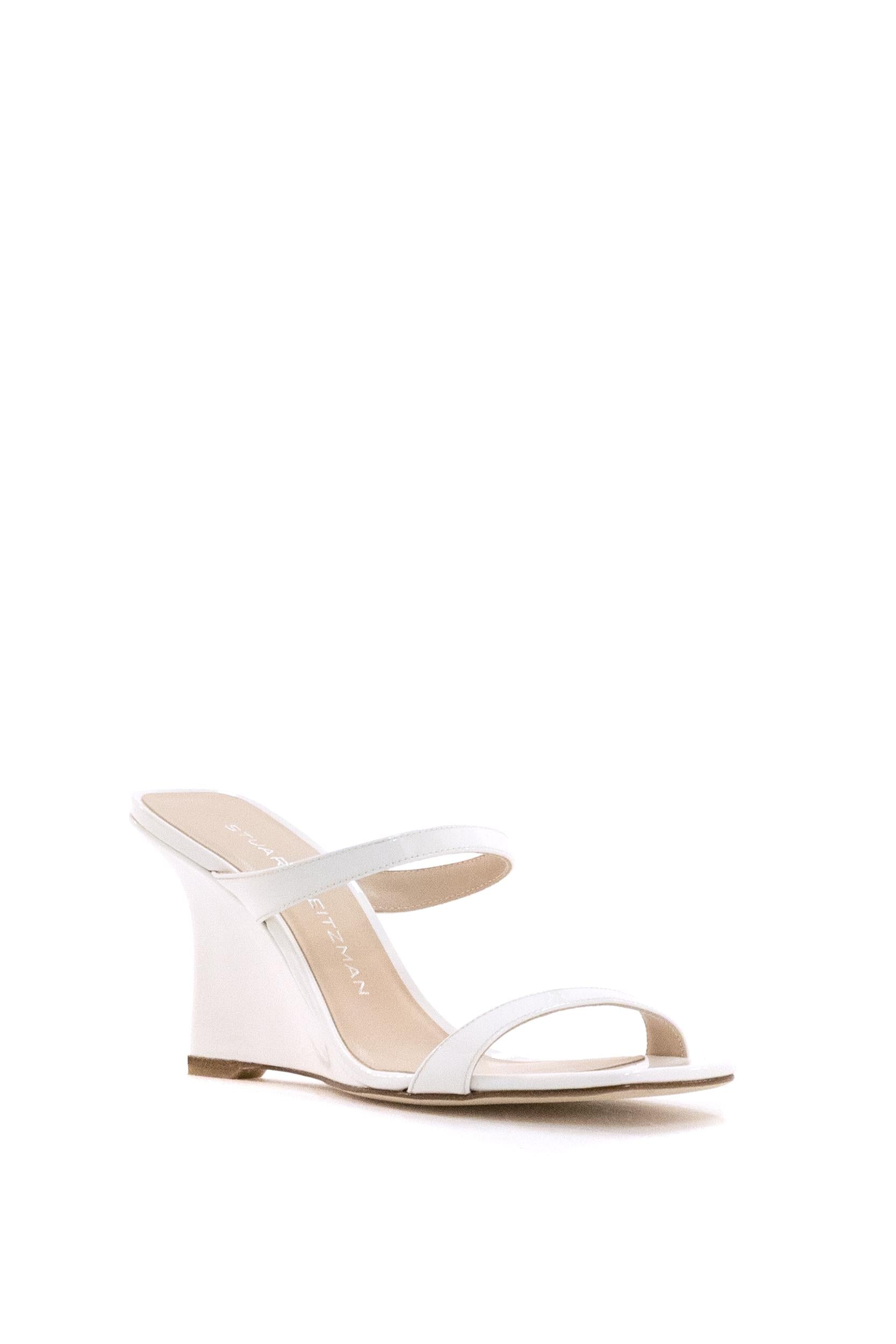 Sandali con zeppa Vinnie in pelle di colore bianco<BR/> VINNIE WEDGE SLIDE 8 BIANCO STUART WEITZMAN