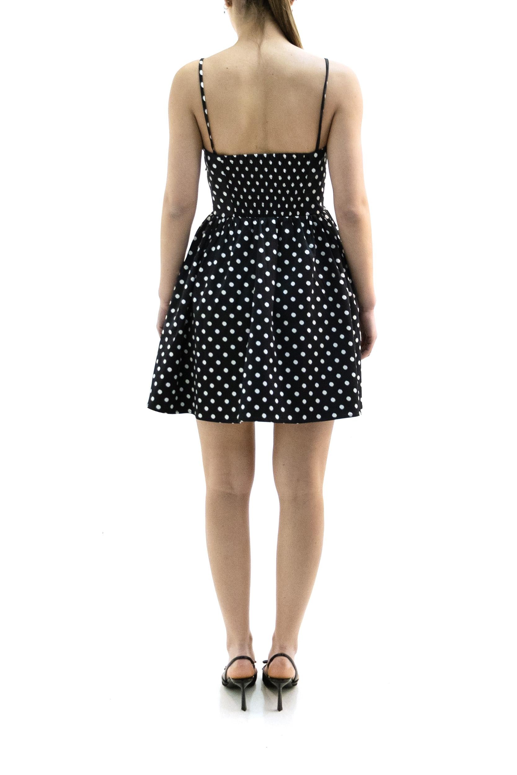 Abito in raso a pois di colore nero e bianco<BR/> A1030193 099 GANNI 