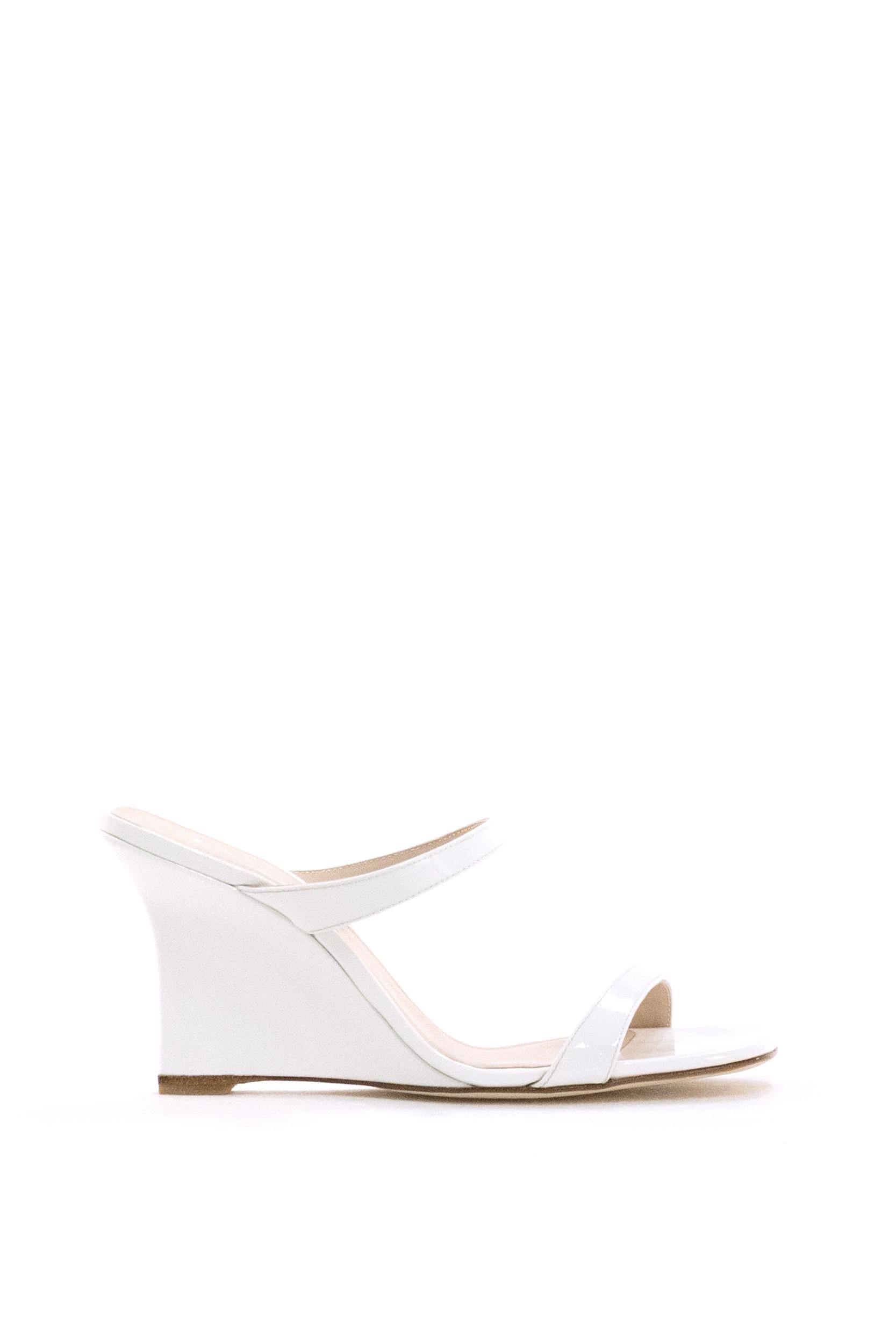 Sandali con zeppa Vinnie in pelle di colore bianco<BR/> VINNIE WEDGE SLIDE 8 BIANCO STUART WEITZMAN 