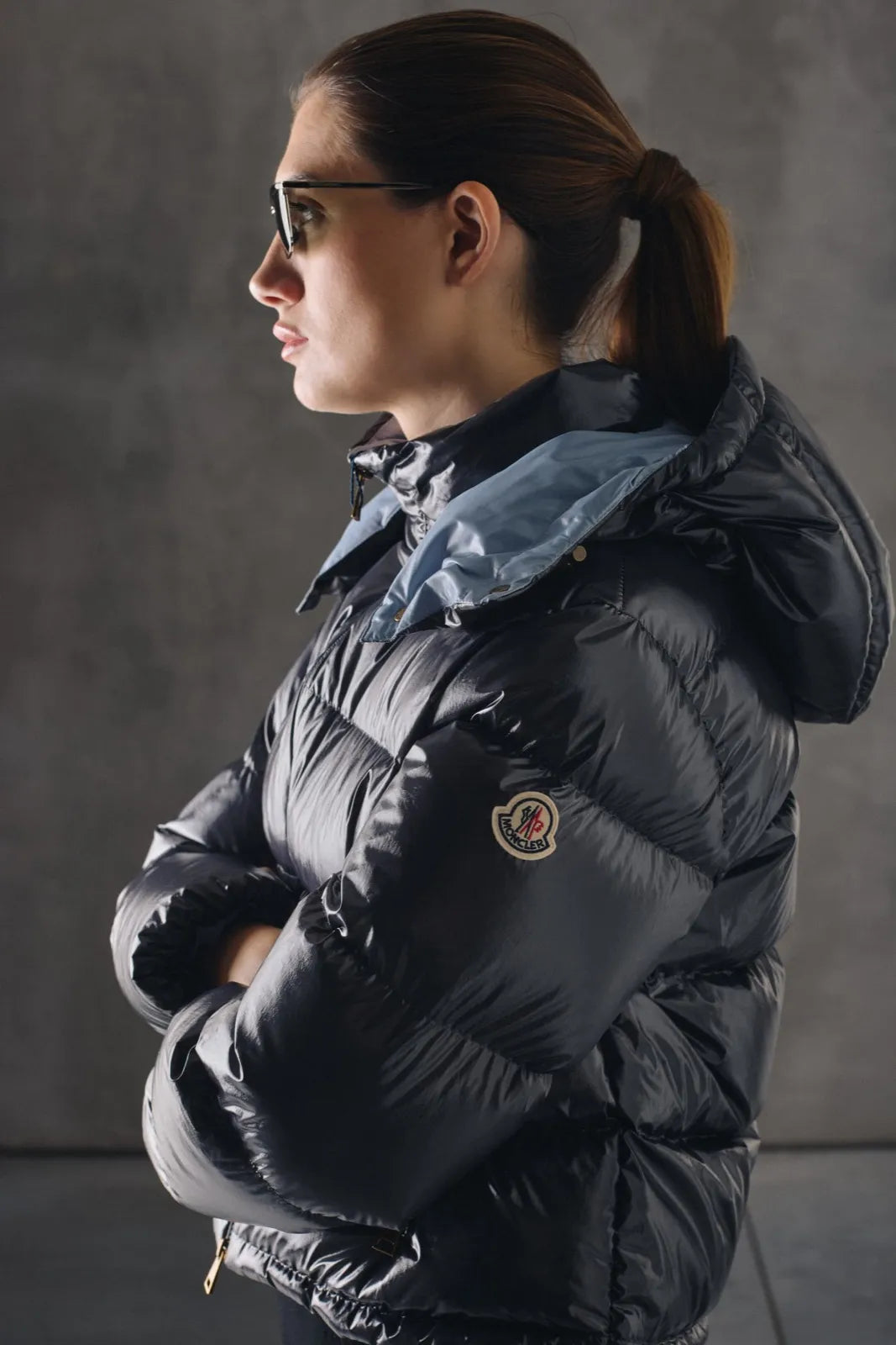 Woman wearing a glossy Moncler down jacket